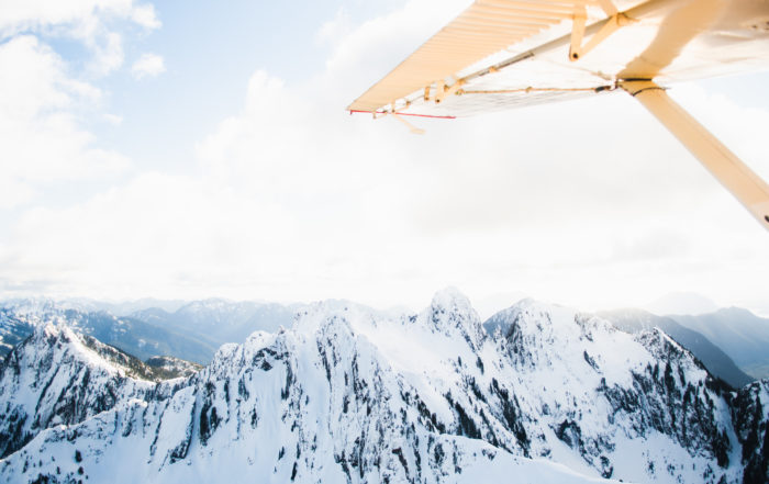 Tofino Air plane over moutains